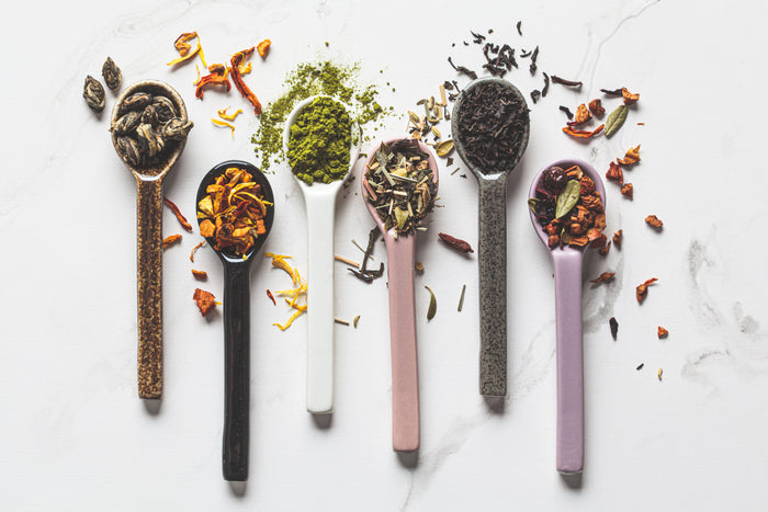 Loose-leaf teas in spoons